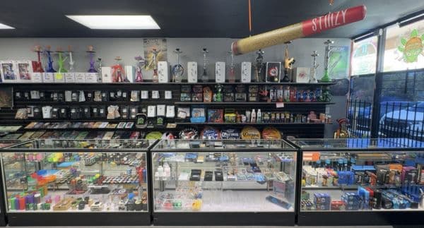 Inside Inhale Exhale Smoke - Jacksonville storefront counter and product wall